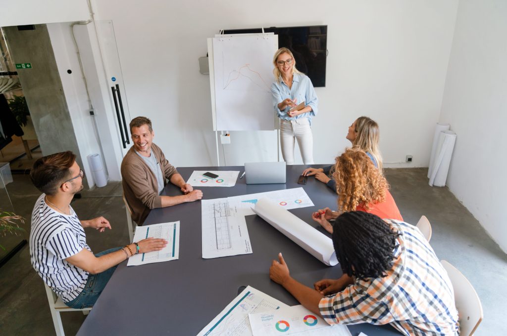 Collaborative process of multicultural skilled people during brainstorming meeting in office Collaborative process of multicultural skilled people during brainstorming meeting in office.Diverse team of young people cooperating on developing project